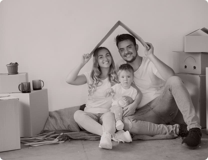 A family sheltering under a roof shape